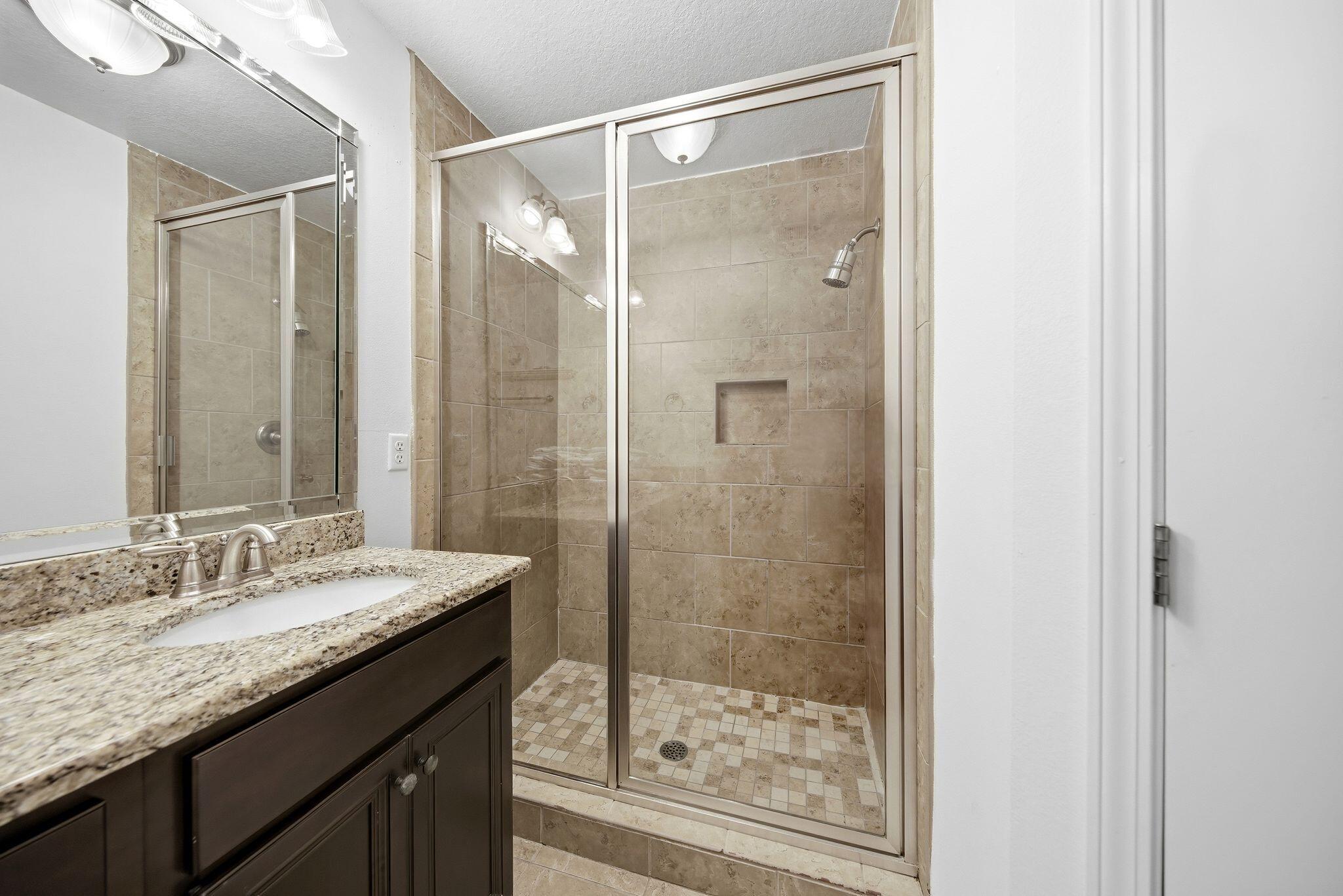 54 West Shore Place Inlet Beach, FL 32461 - Photo 21 of 38 a bathroom with a granite countertop sink shower and a mirror
