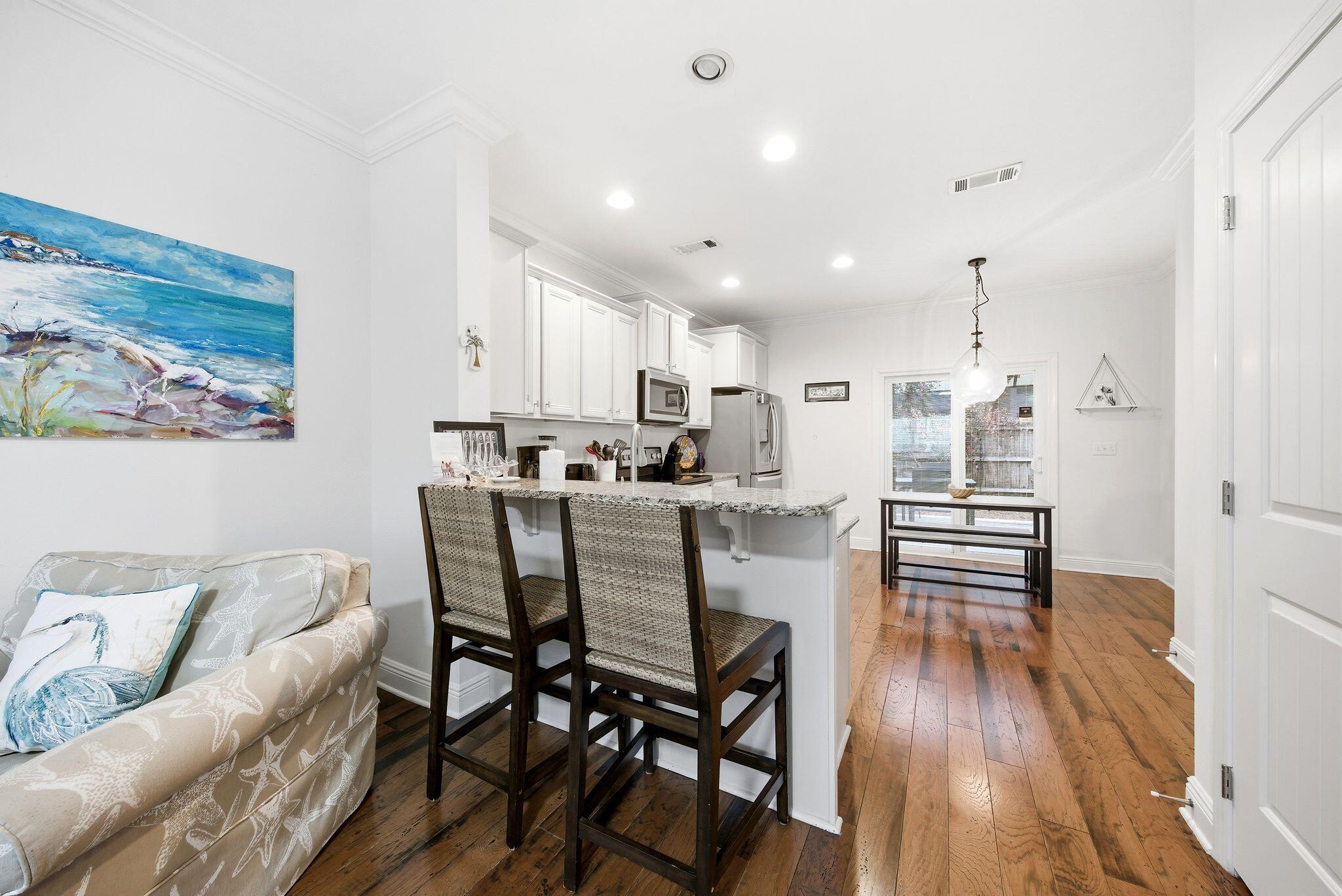 54 West Shore Place Inlet Beach, FL 32461 - Photo 9 of 38 a view of a dining room with furniture and wooden floor