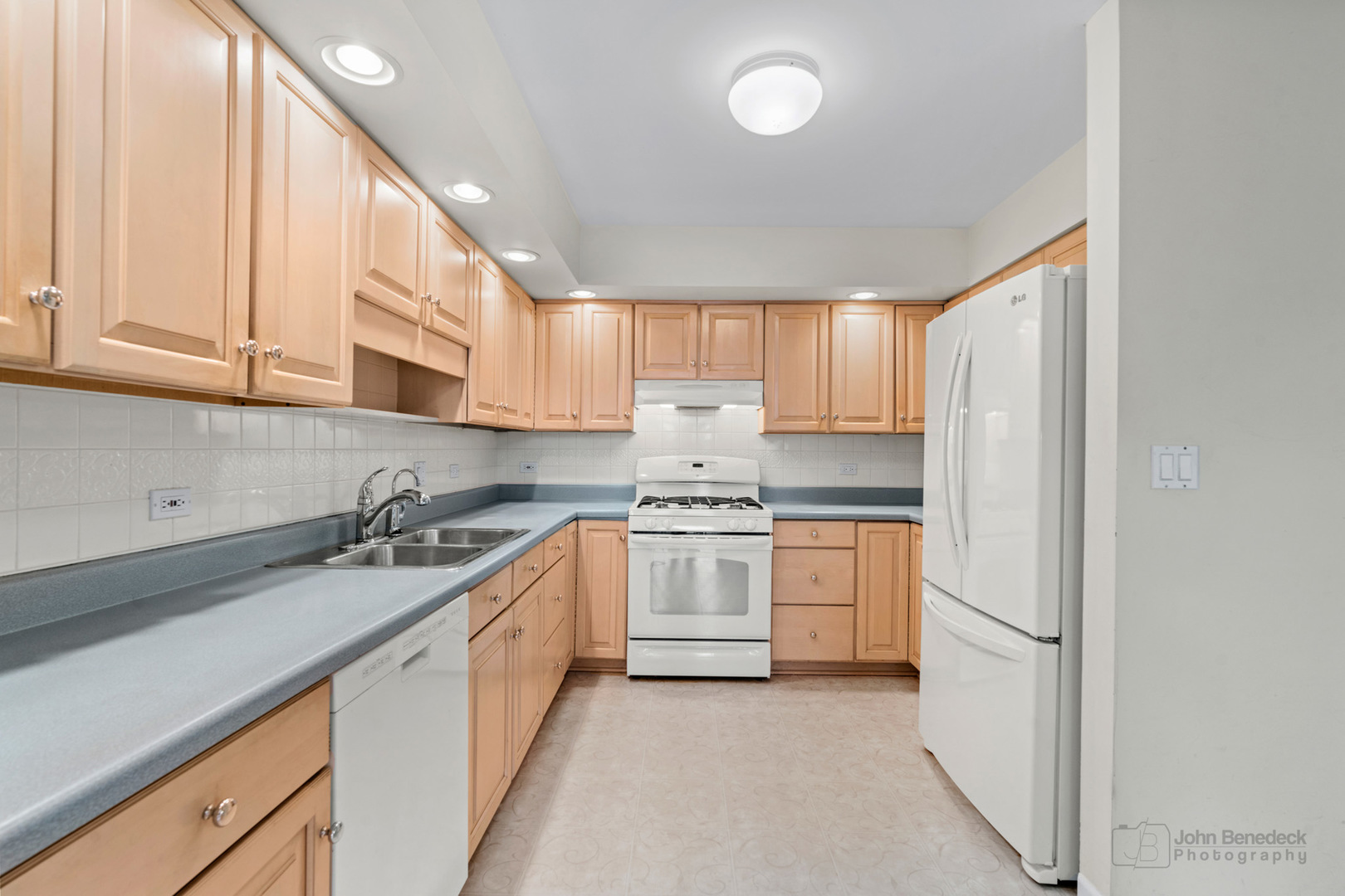 1931 Cranbrook Drive Green Oaks, IL 60048 - Photo 7 of 33 a kitchen with a sink a stove and cabinets