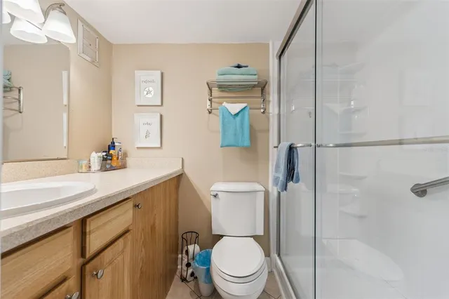 a living room with furniture a rug and a flat screen tv