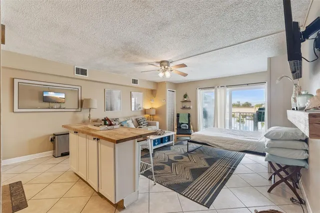 a kitchen that has a cabinets and a stove in it