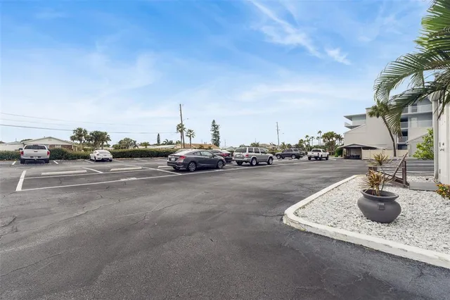 a front view of a house with swimming pool and furniture
