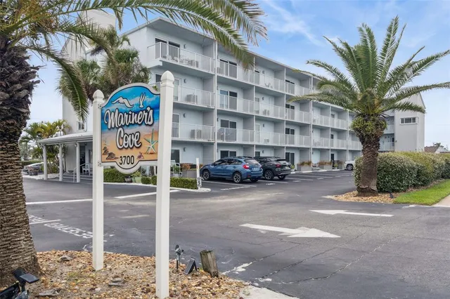 a view of a building with a yard