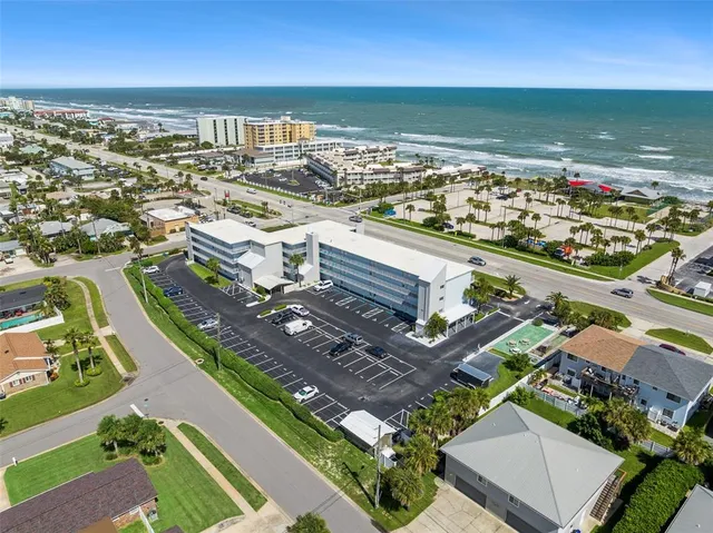 an aerial view of a city with ocean view