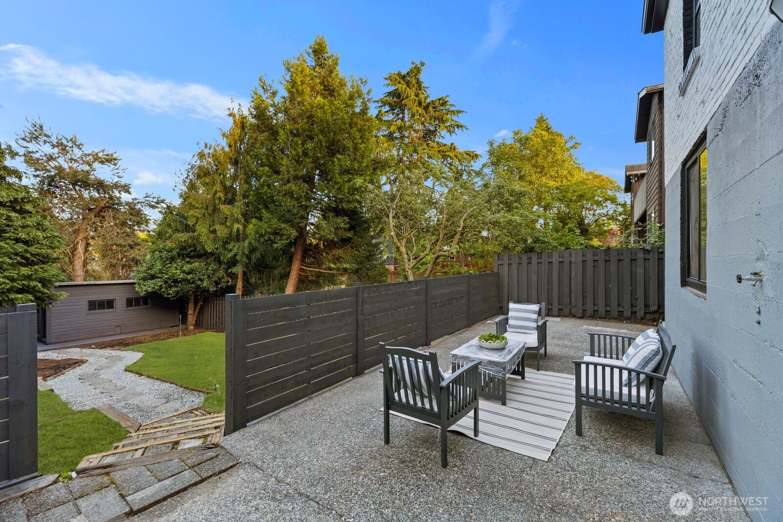 8216 Interlake Avenue North Seattle, WA 98103 - Photo 23 of 36 a view of a chairs and tables in the backyard