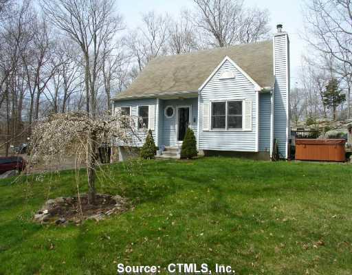 21 Airline Road Clinton, CT 06413 - Photo 1 of 1 a front view of house with a garden and patio