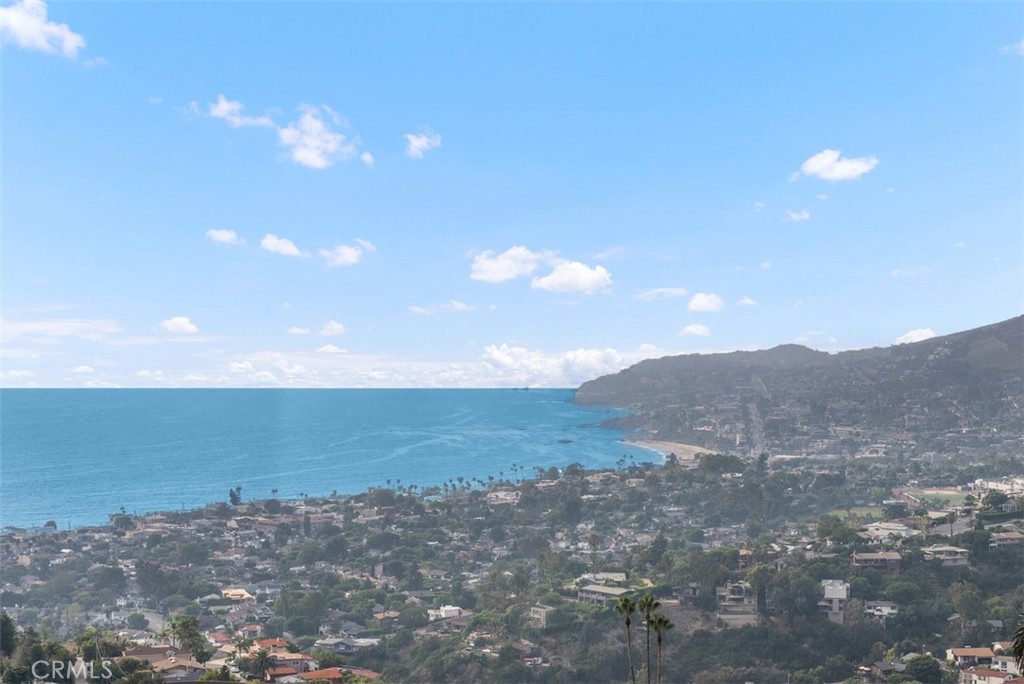 a view of an ocean beach and mountain