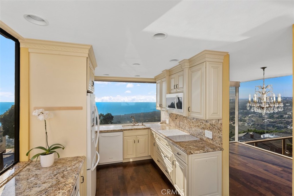 1339 La Mirada Street Laguna Beach, CA 92651 - Photo 12 of 28 a kitchen with a sink stove and refrigerator