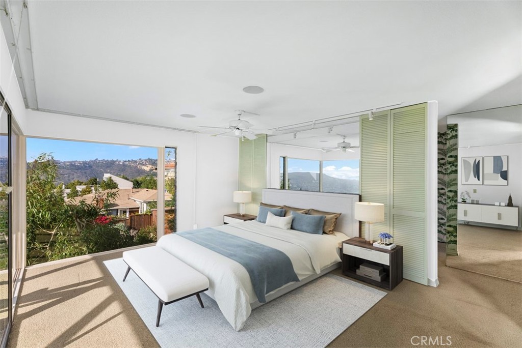 1339 La Mirada Street Laguna Beach, CA 92651 - Photo 16 of 28 a bedroom with a bed and large window
