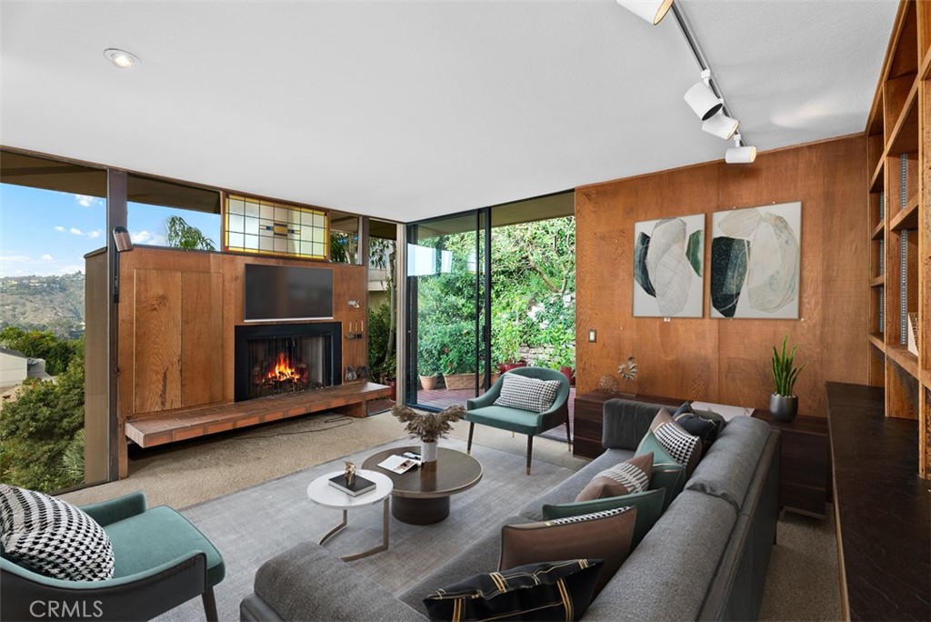 1339 La Mirada Street Laguna Beach, CA 92651 - Photo 8 of 28 a living room with furniture and a fireplace