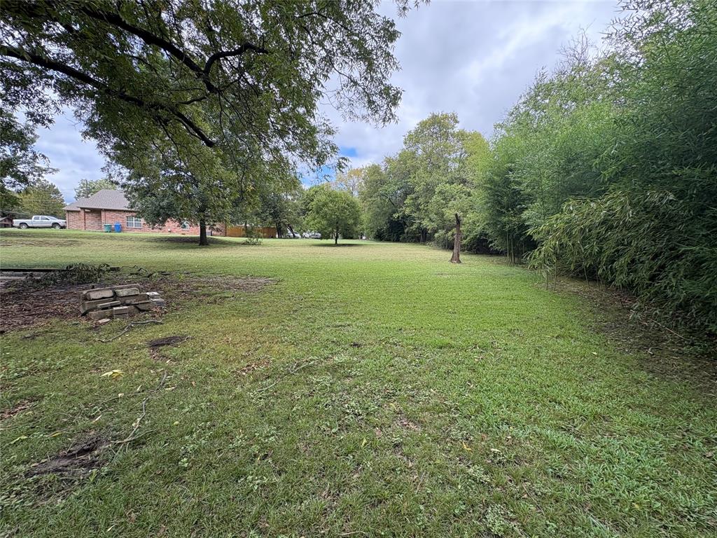 625 South Rusk Street Sherman, TX 75090 - Photo 19 of 19 a view of outdoor space with trees all around