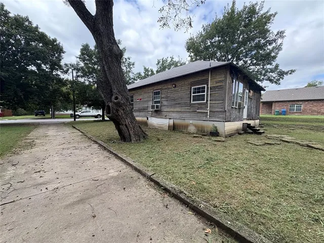 a backyard of a house with lots of green space