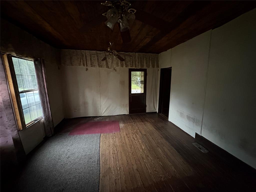 625 South Rusk Street Sherman, TX 75090 - Photo 8 of 19 a view of wooden floor and windows in an empty room