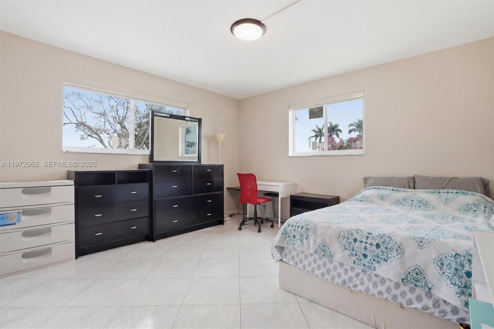 5518 McKinley Street Hollywood, FL 33021 - Photo 11 of 21 a bedroom with a bed and a dresser