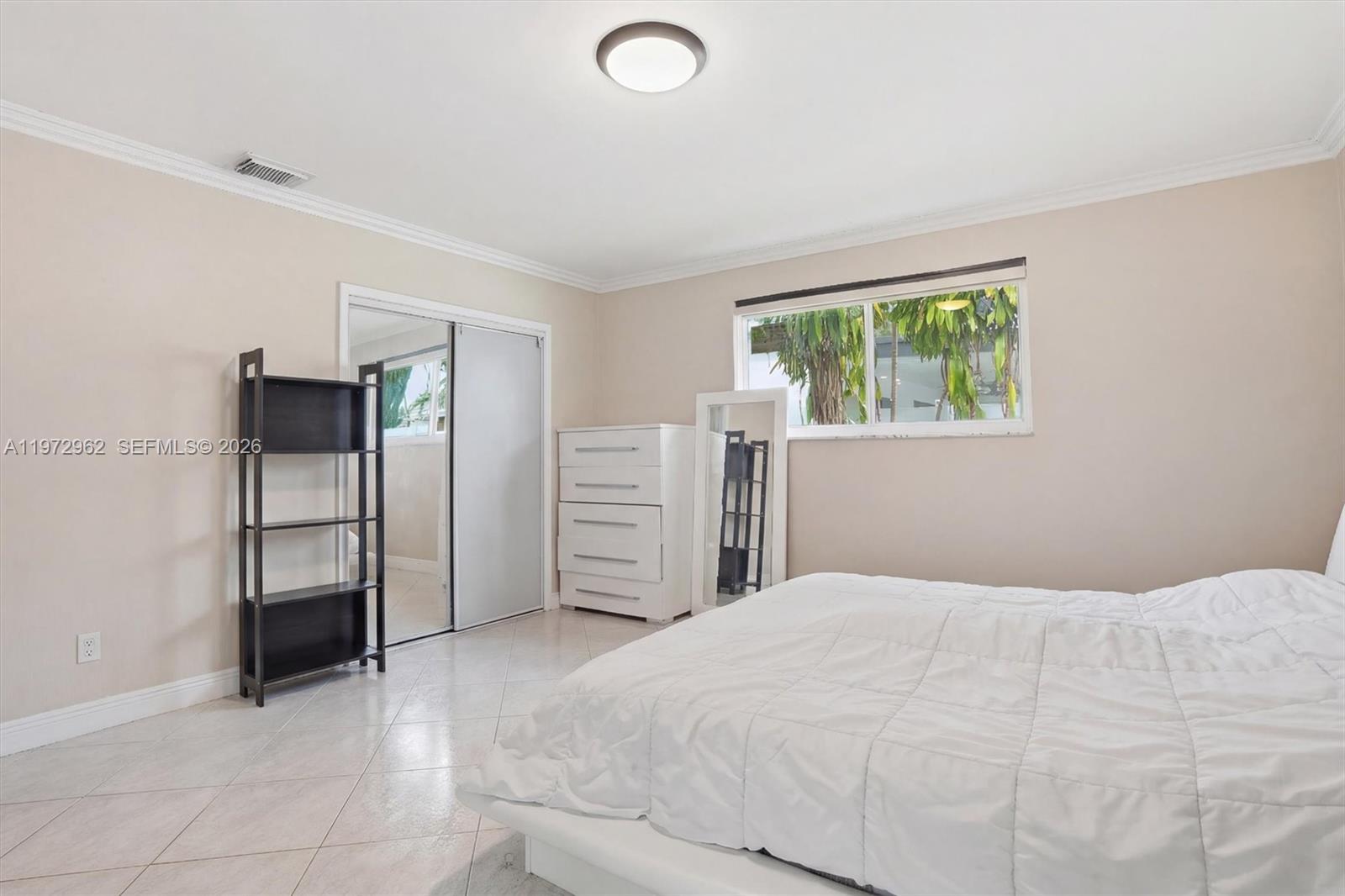 5518 McKinley Street Hollywood, FL 33021 - Photo 14 of 21 a bedroom with a bed and a cabinets