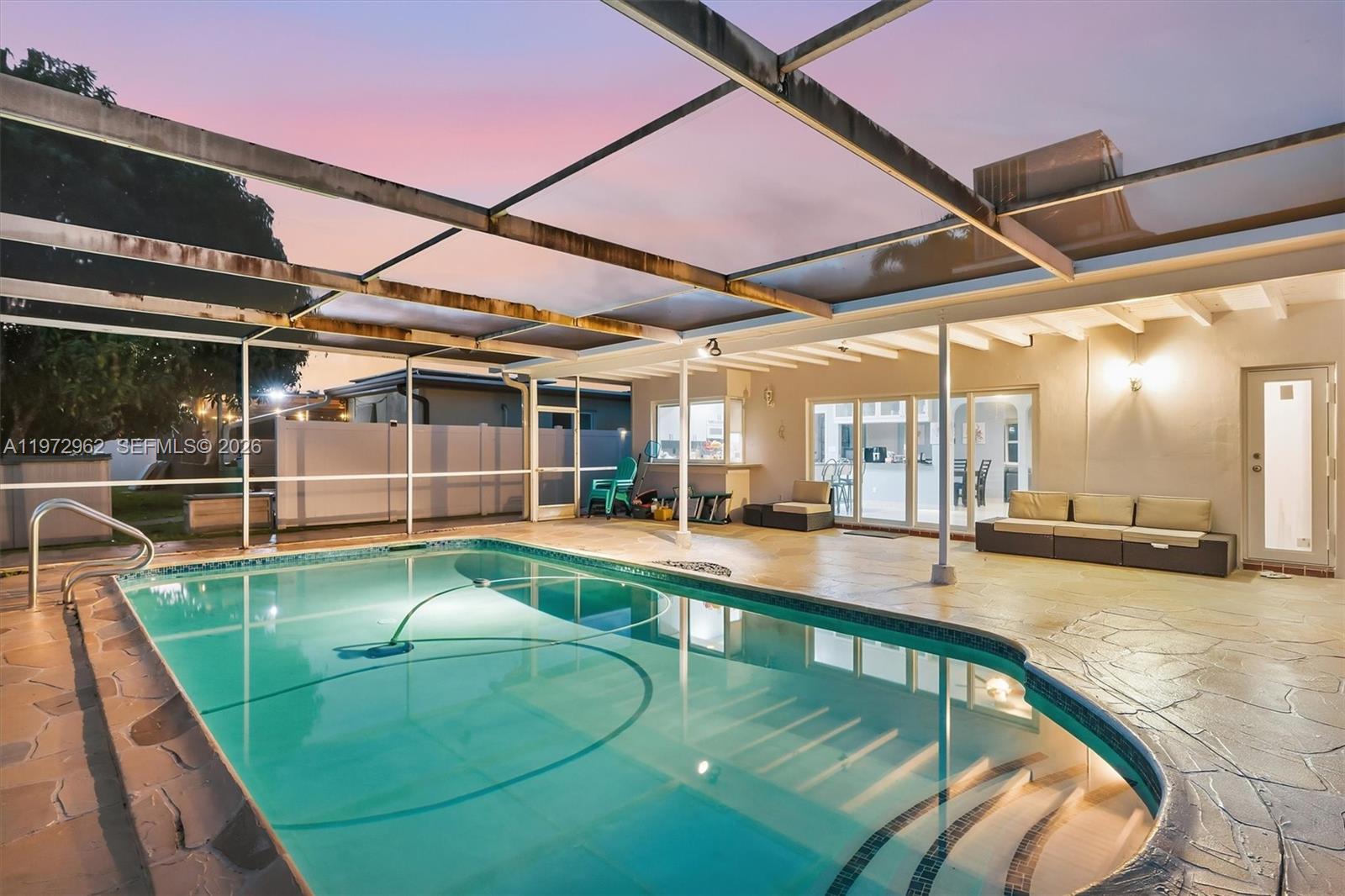 5518 McKinley Street Hollywood, FL 33021 - Photo 20 of 21 a view of a swimming pool with a patio