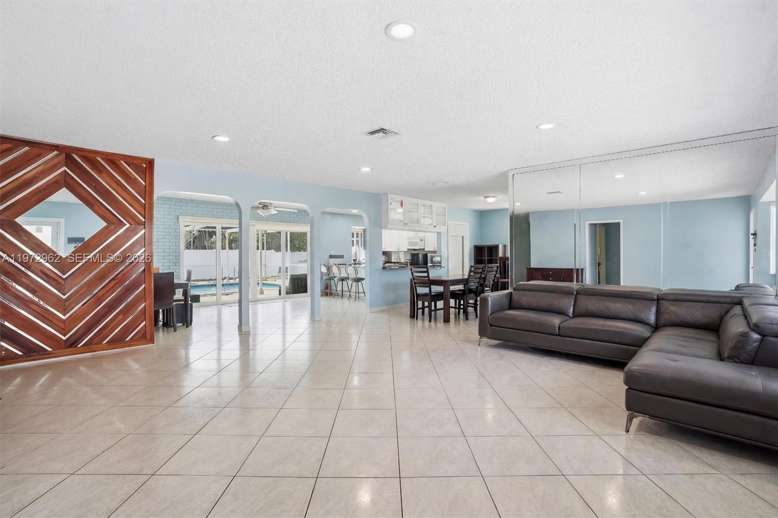 5518 McKinley Street Hollywood, FL 33021 - Photo 3 of 21 a living room with furniture and a table