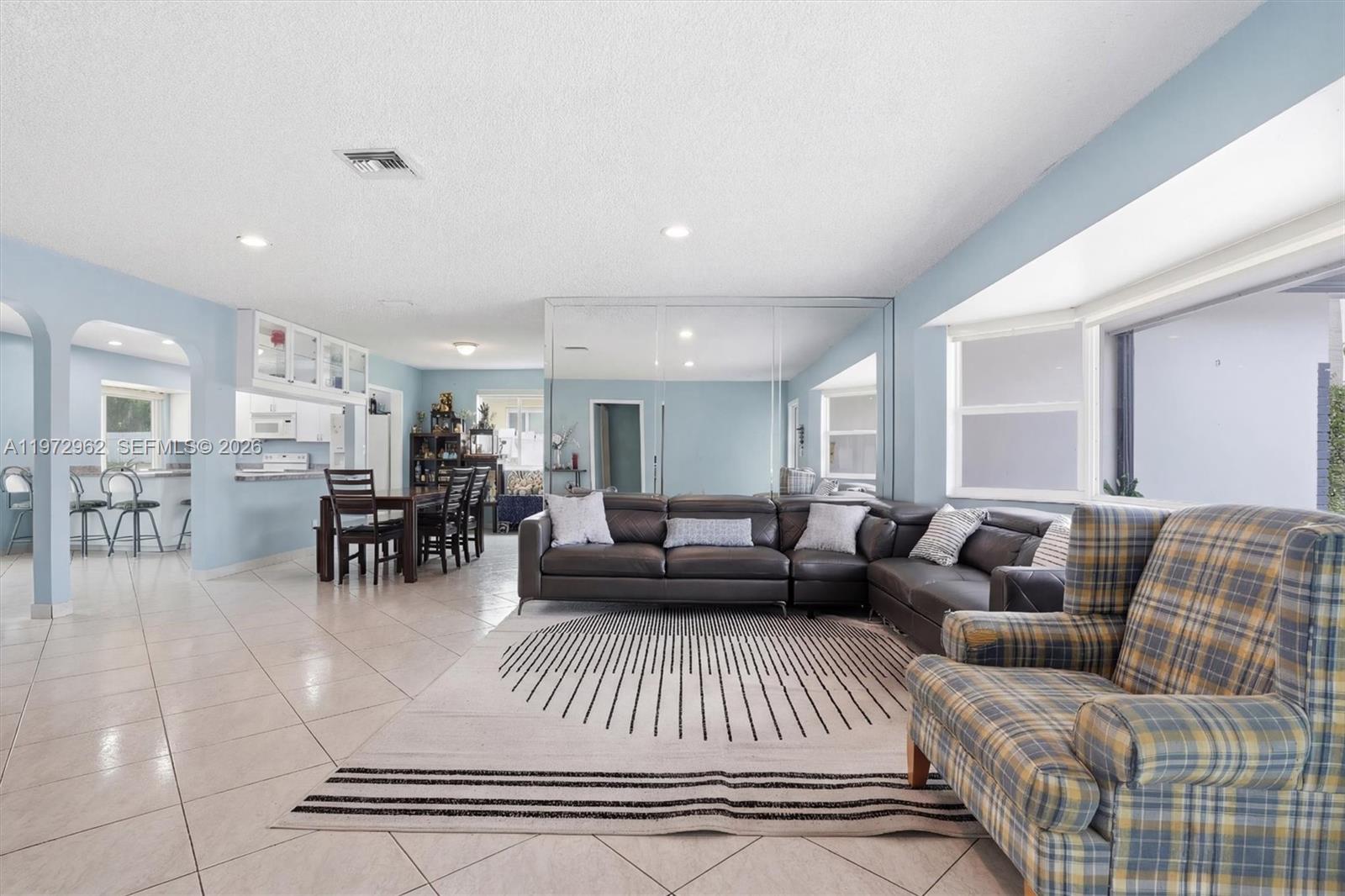 5518 McKinley Street Hollywood, FL 33021 - Photo 4 of 21 a living room with furniture and a table