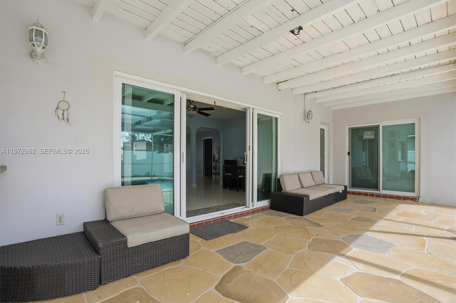 5518 McKinley Street Hollywood, FL 33021 - Photo 8 of 21 a living room with furniture and a rug