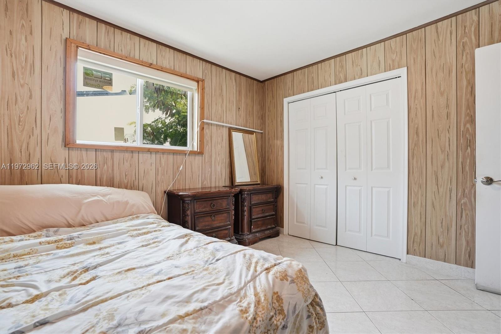 5518 McKinley Street Hollywood, FL 33021 - Photo 10 of 21 a bedroom with a bed and a window