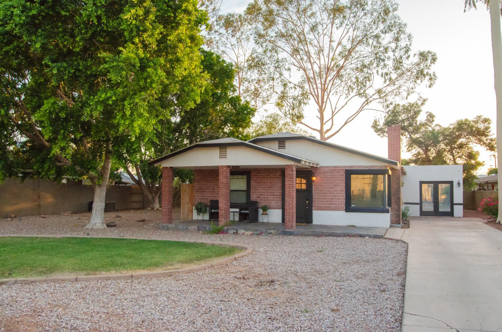 3202 North 37th Street Phoenix, AZ 85018 - Photo 2 of 19 a view of a house with a yard and large tree