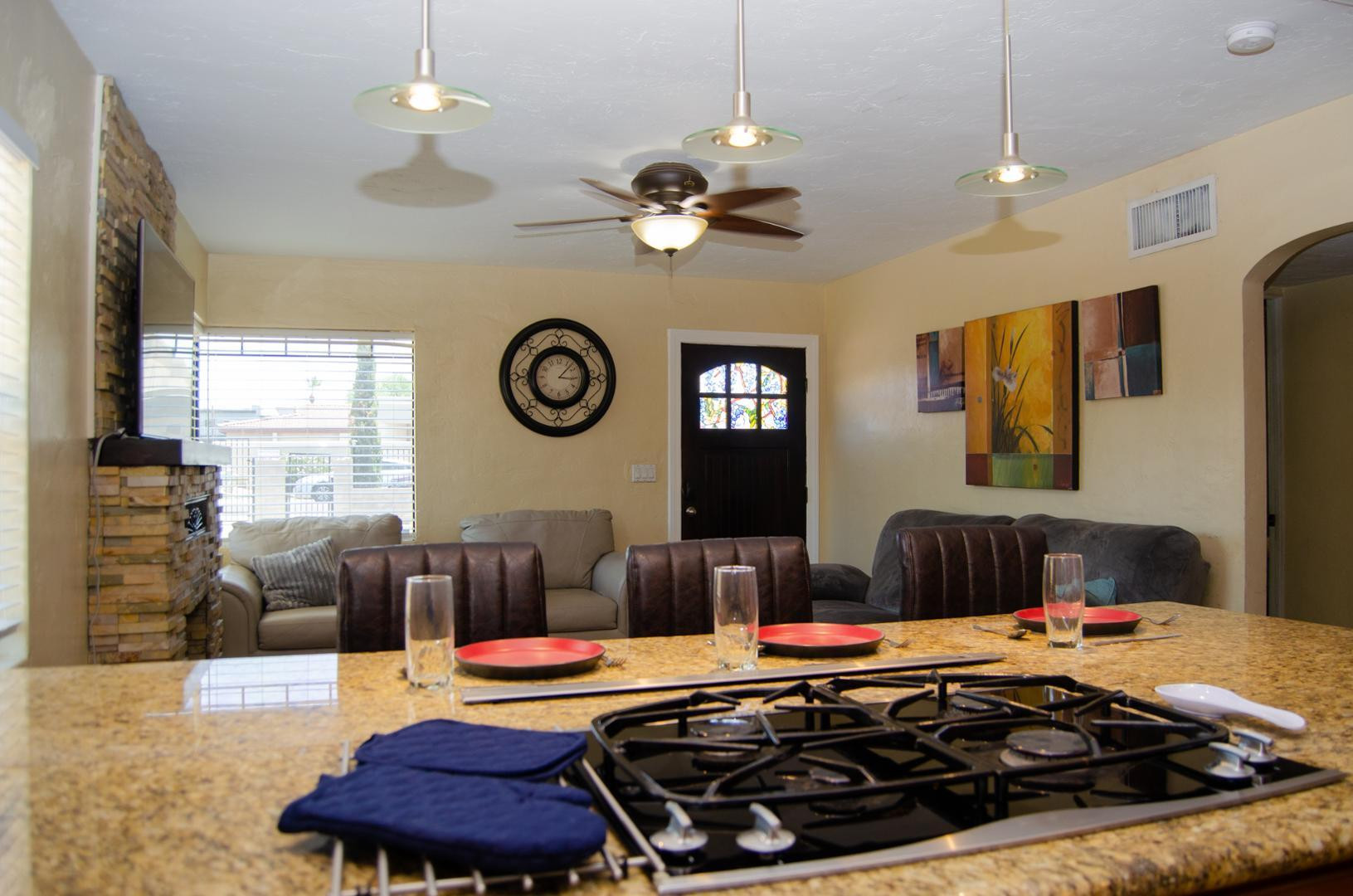 3202 North 37th Street Phoenix, AZ 85018 - Photo 9 of 19 a living room with stainless steel appliances furniture a chandelier and a table
