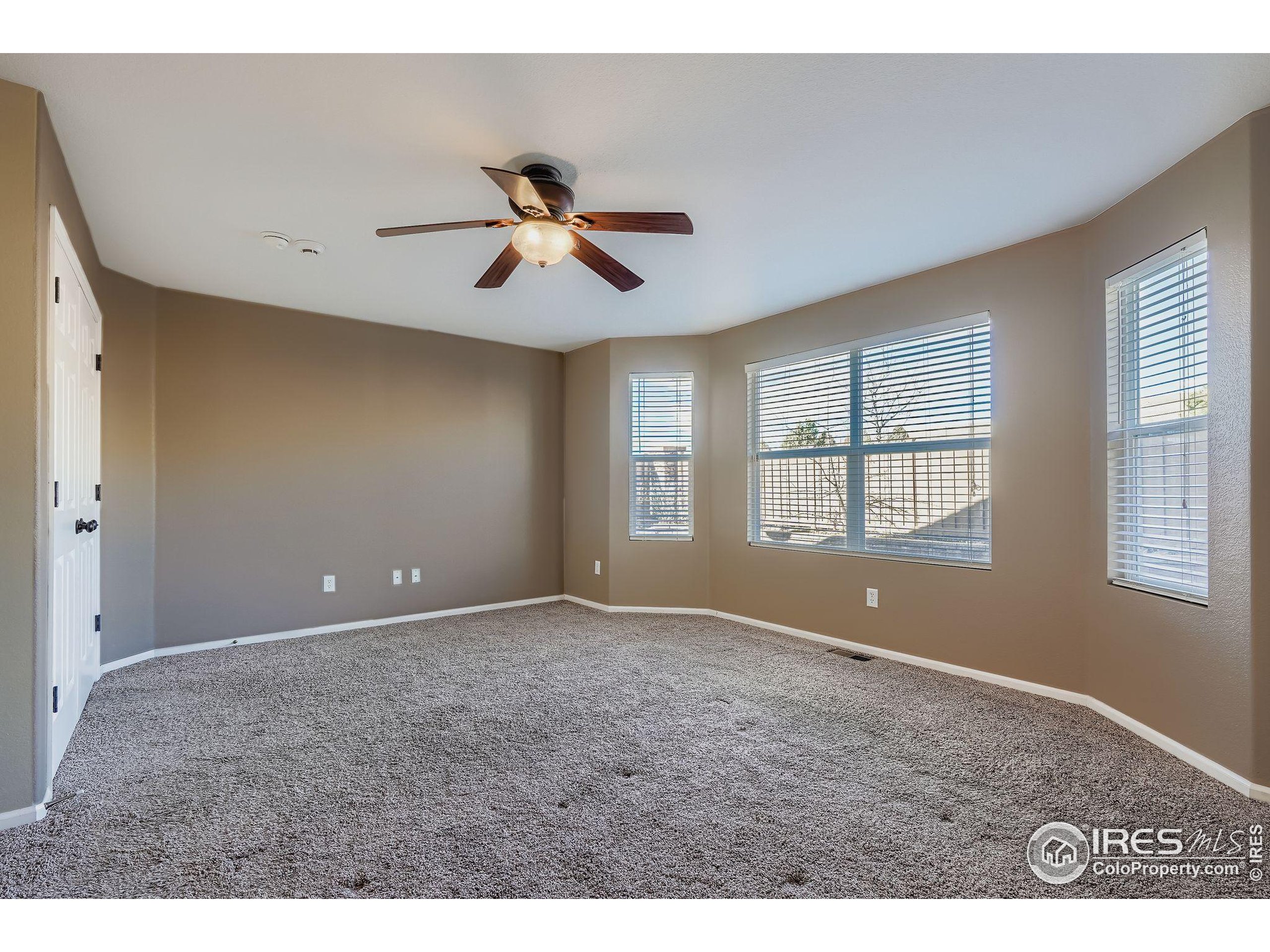 2011 Alpine Drive Erie, CO 80516 - Photo 12 of 21 a view of an empty room with a window