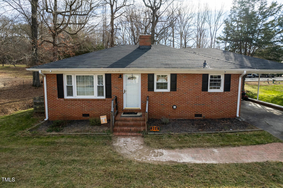 904 Frank Street Roxboro, NC 27573 - Photo 1 of 20 a front view of a house with garden