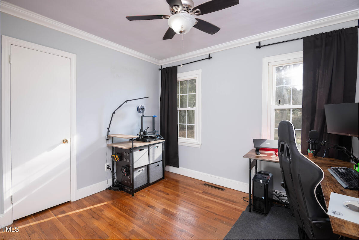 904 Frank Street Roxboro, NC 27573 - Photo 13 of 20 a view of a workspace with furniture and a window