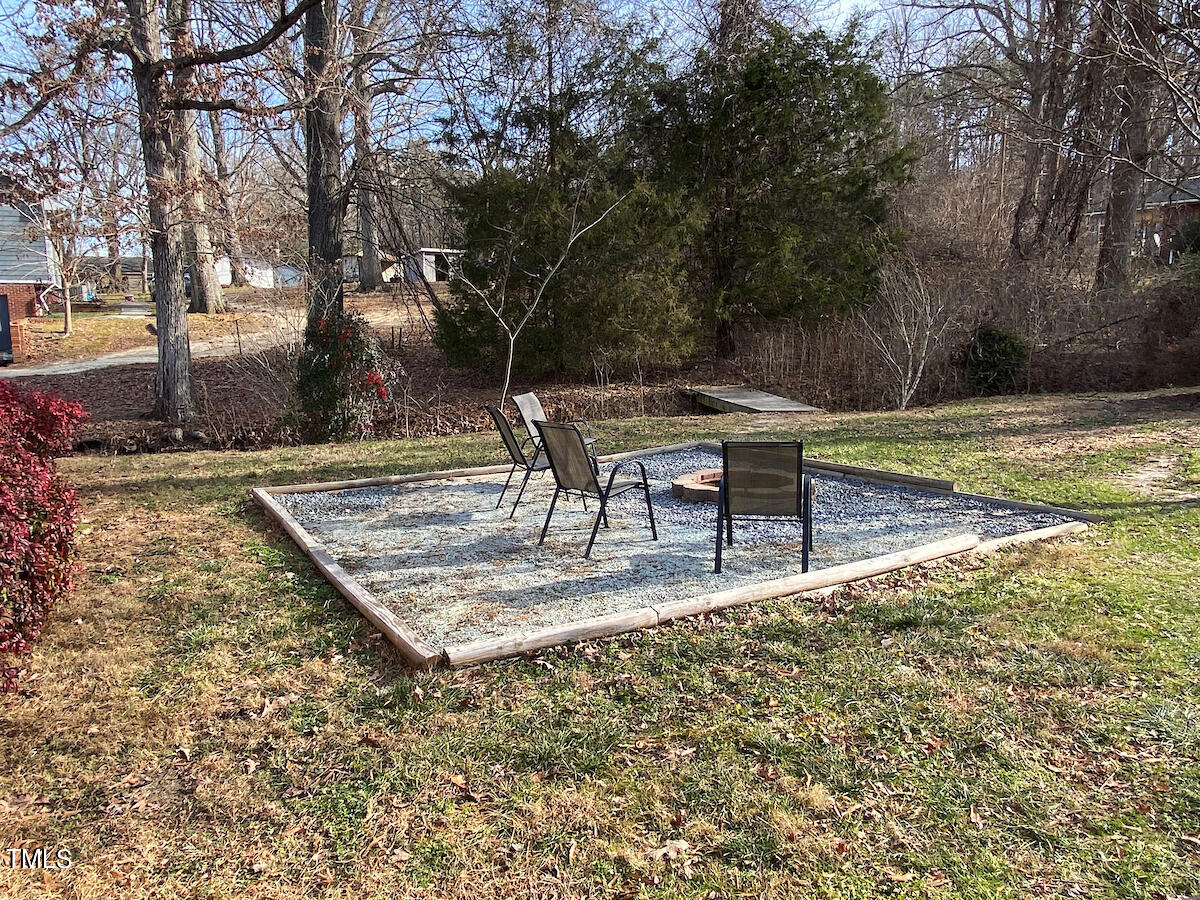904 Frank Street Roxboro, NC 27573 - Photo 17 of 20 a view of a yard with table and chairs