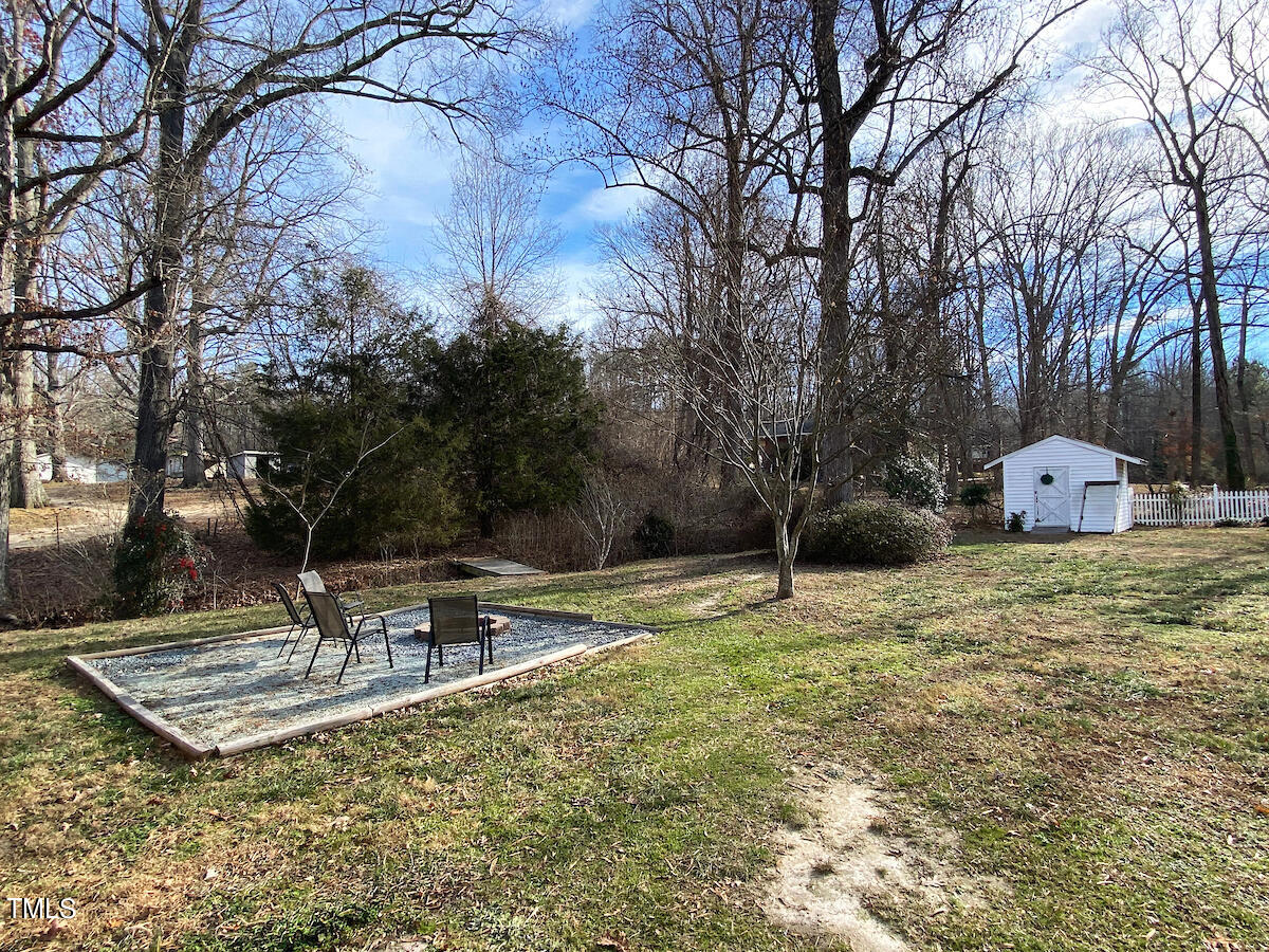 904 Frank Street Roxboro, NC 27573 - Photo 18 of 20 a backyard of a house with table and chairs