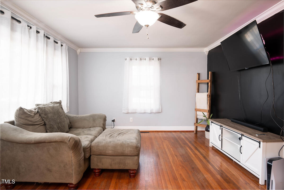 904 Frank Street Roxboro, NC 27573 - Photo 5 of 20 a living room with furniture and a flat screen tv