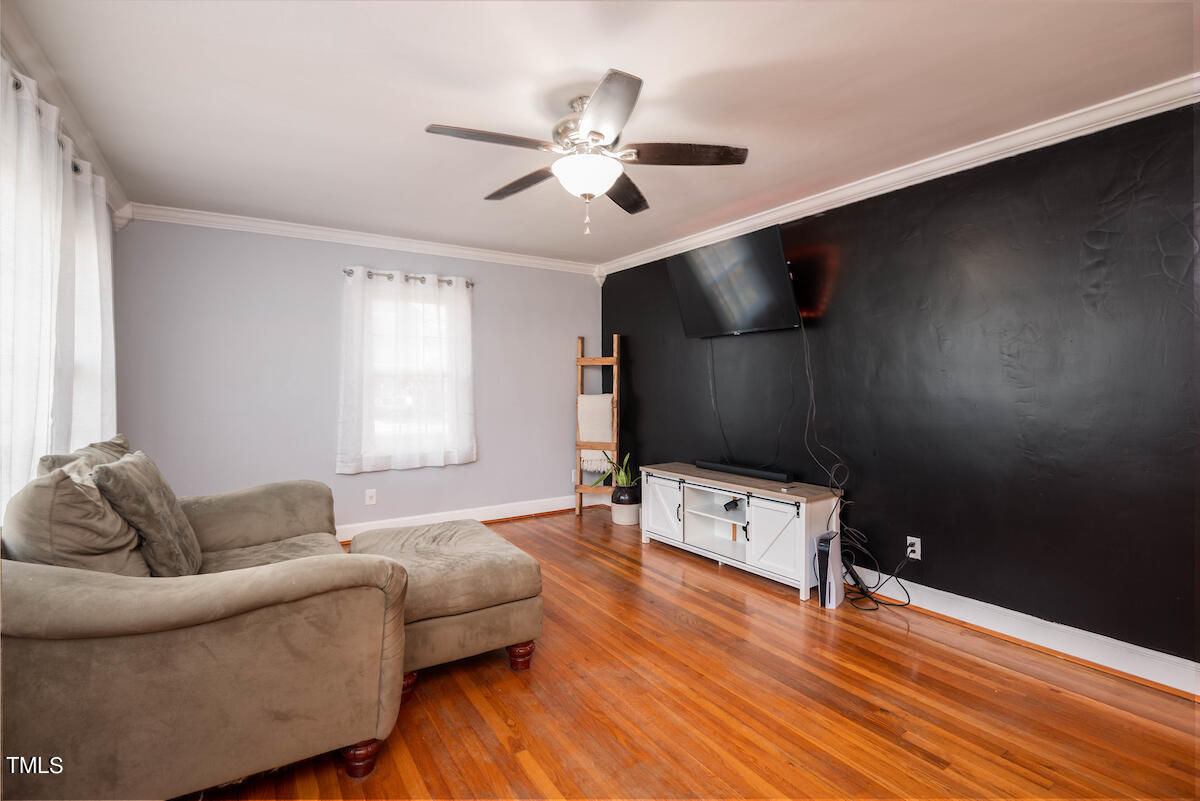904 Frank Street Roxboro, NC 27573 - Photo 6 of 20 a living room with furniture and a wooden floor