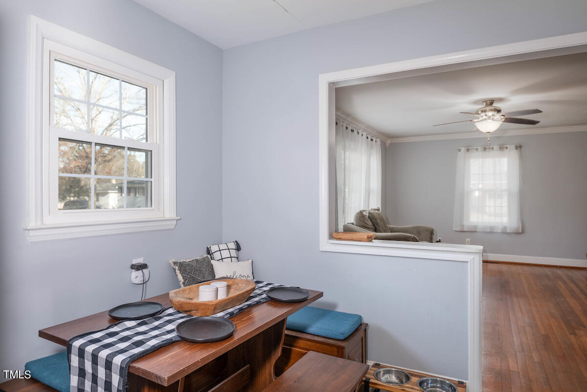 904 Frank Street Roxboro, NC 27573 - Photo 8 of 20 a view of a workspace with furniture and a window