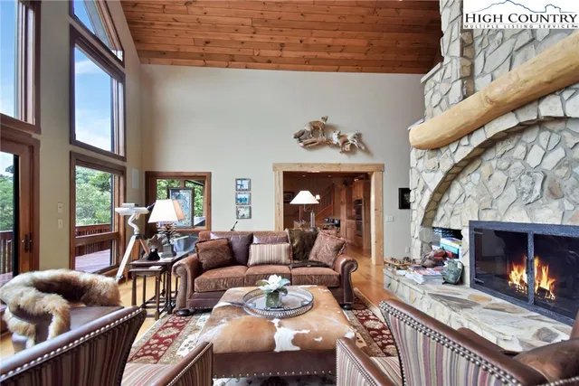 a large kitchen with stainless steel appliances granite countertop a lot of counter space and wooden floors