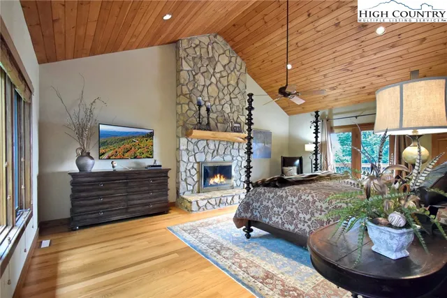 a bedroom with a bed and a lamp