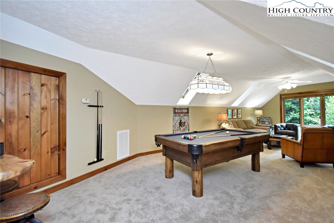 86 Tyneridge Road Banner Elk, NC 28604 - Photo 36 of 50 a living room with furniture a window and a table