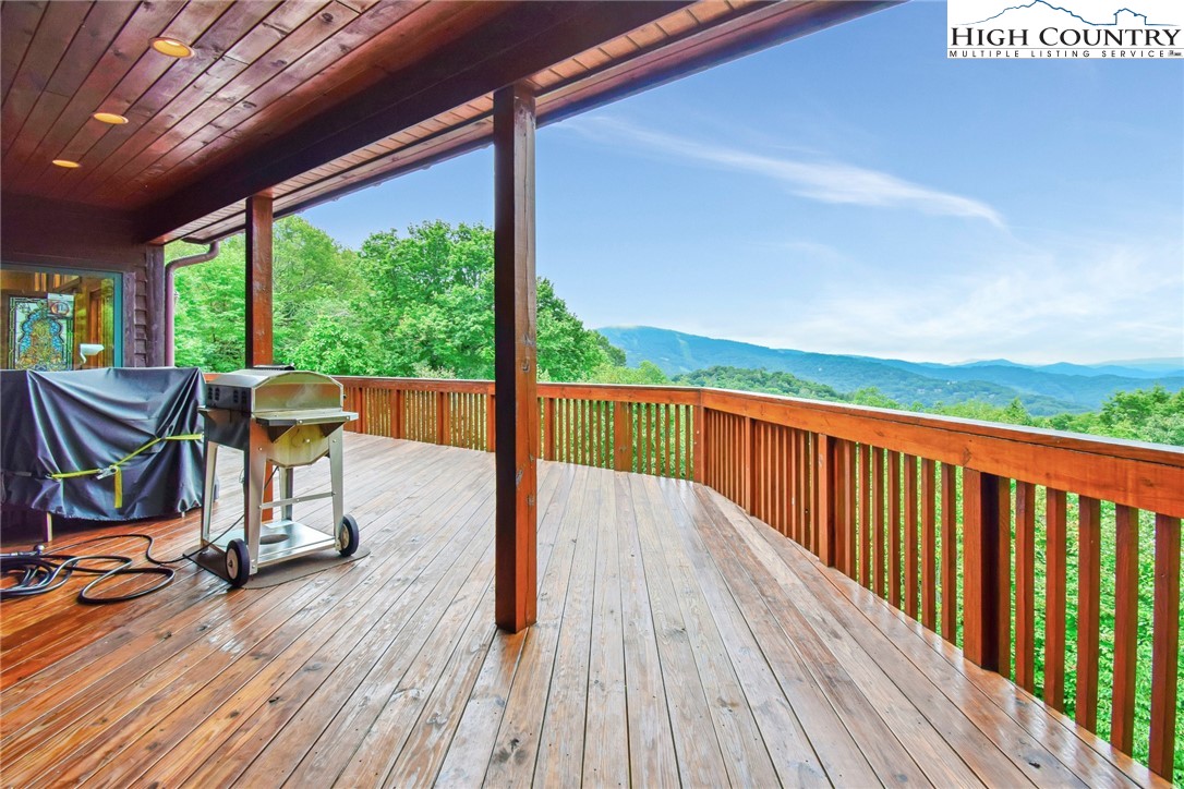 86 Tyneridge Road Banner Elk, NC 28604 - Photo 39 of 50 a view of balcony with wooden floor and outdoor seating