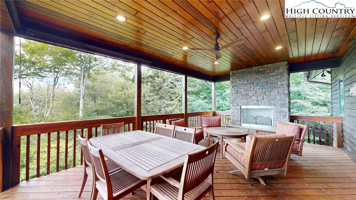 86 Tyneridge Road Banner Elk, NC 28604 - Photo 42 of 50 a view of a patio with a table chairs and a patio