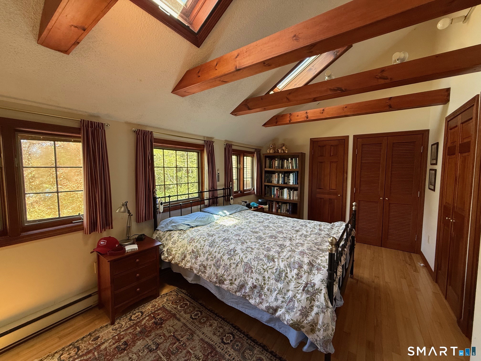 8 Ivy Road Stonington, CT 06355 - Photo 21 of 30 a bed sitting in a spacious bedroom next to a window