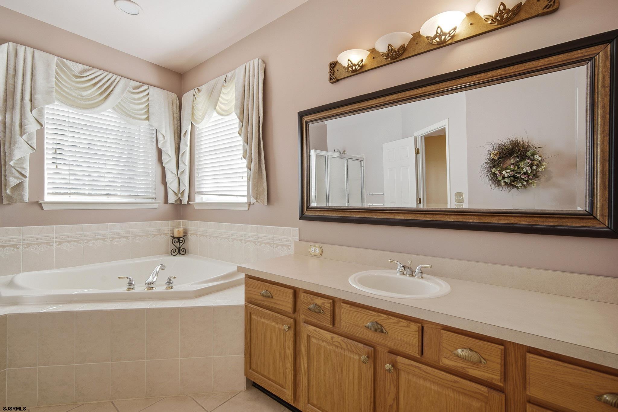 102 Warwick Road Galloway Township, NJ 08205 - Photo 21 of 45 a bathroom with a sink and a bathtub