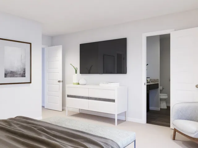 a bedroom with a bed and a large mirror