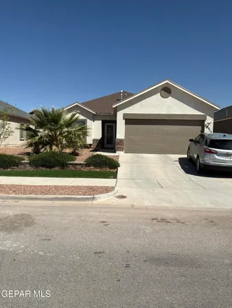 a view of garage and car parked