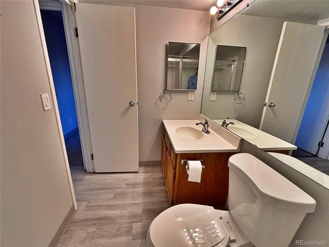 a bathroom with a shower a toilet and a glass door shower