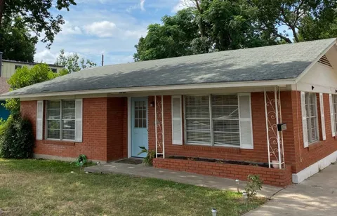 a house with trees in the background