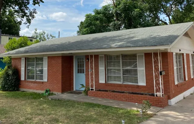 a house with trees in the background