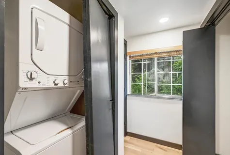 a view of bathroom with a sink and a mirror
