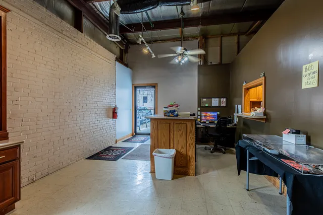 a view of a workspace with furniture