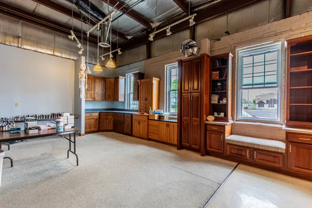 a view of living room with furniture and a chandelier