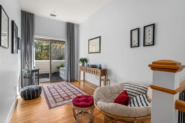 a bedroom with furniture and a large window